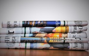 Blog Post Read the News Late by Rick Hamlin; Image of Newspapers; Photograph by Kai Stachowiak